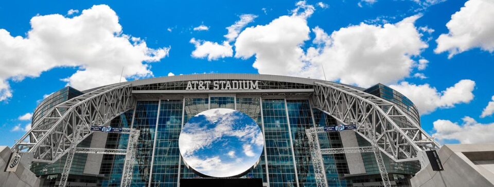 AT&T Stadium exterior beneath the sky mirror
