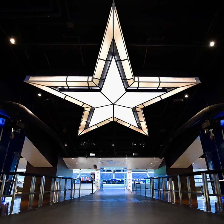 Illuminated Cowboys star hallway inside AT&T Stadium