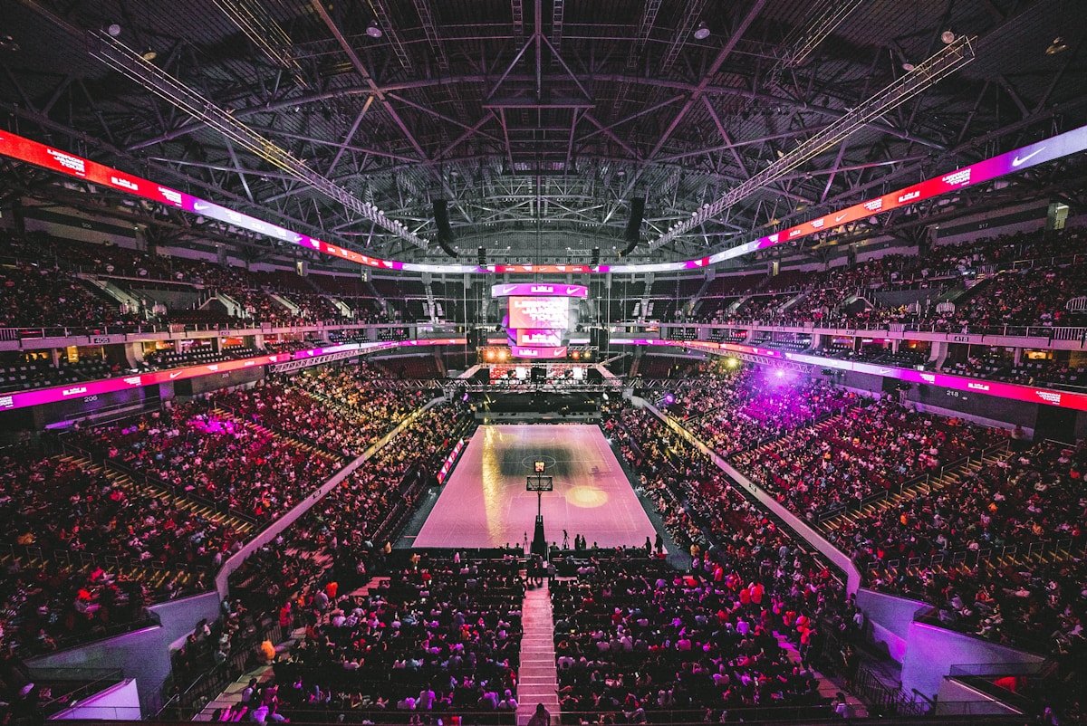 Fans watching a basketball game in an arena