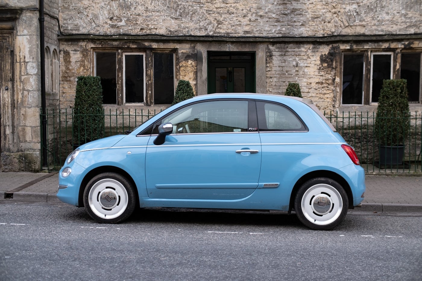 Blue car parked on a street