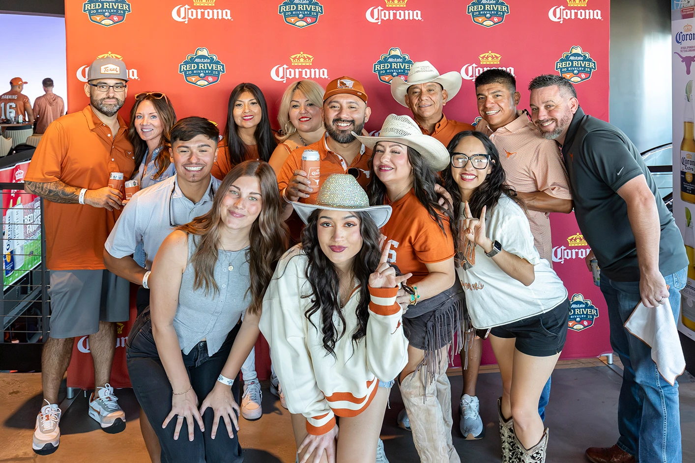 Fans experiencing college football at Cosm Dallas