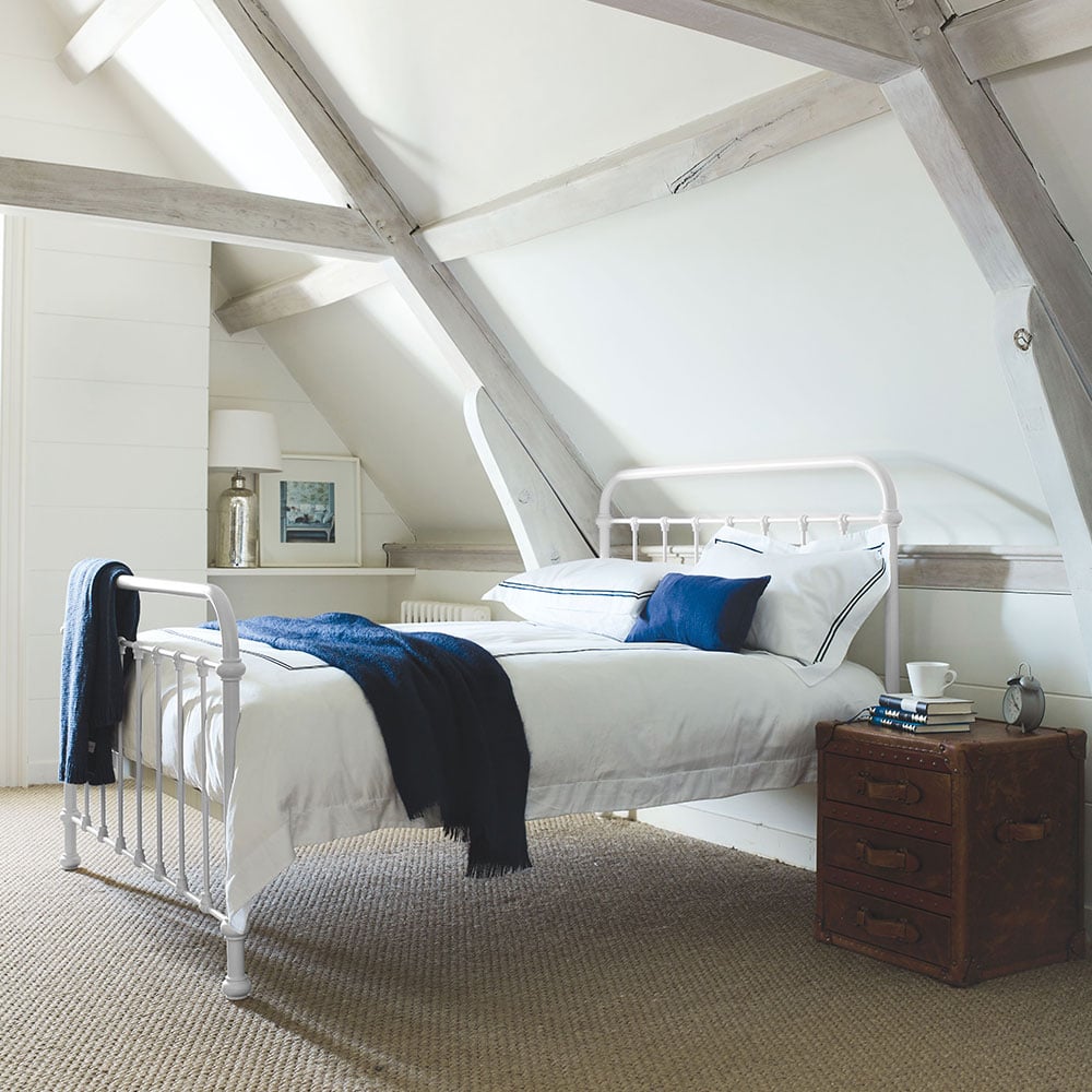 Oliver metal king bed in a styled bedroom