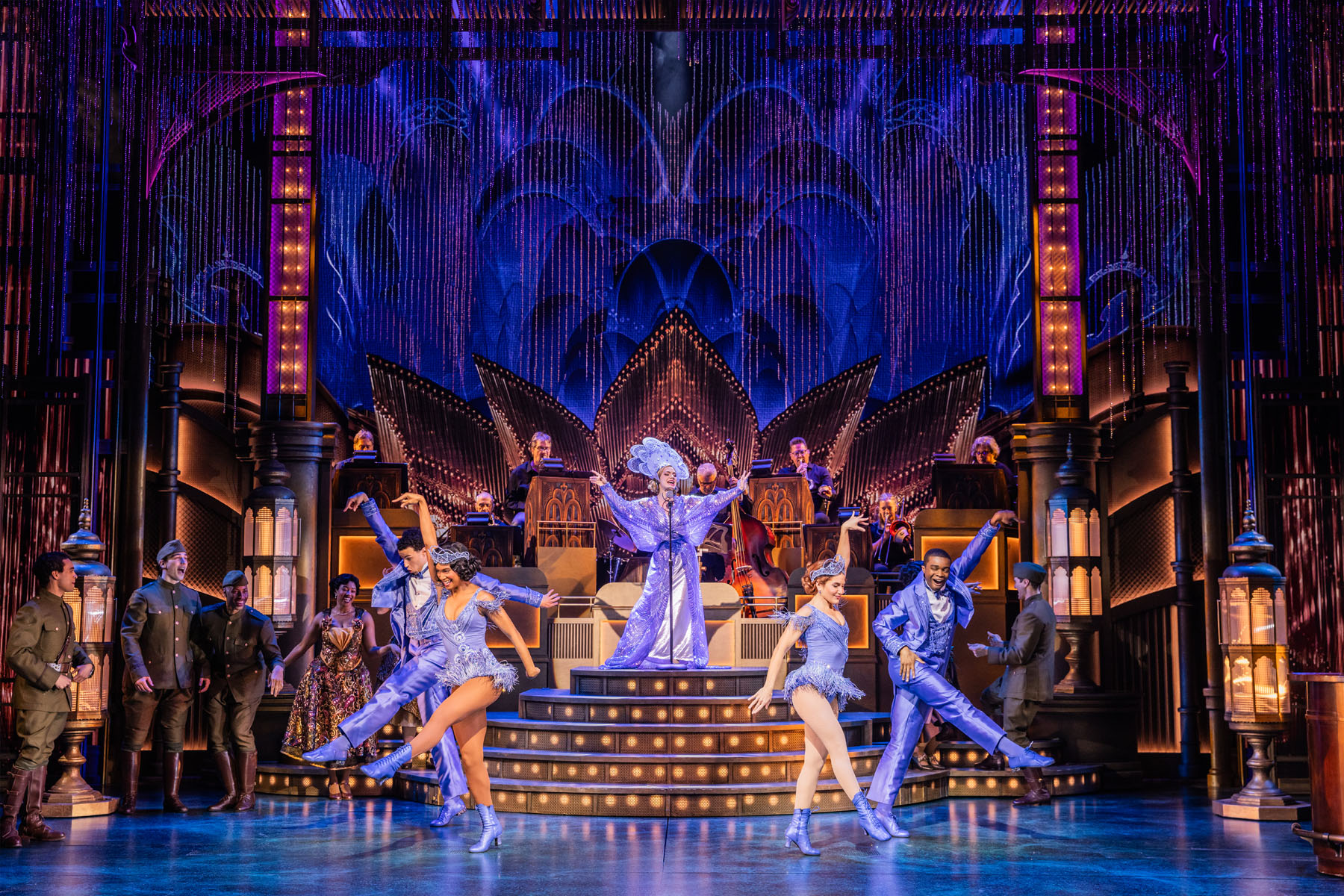 Costumed Broadway performers in a dramatic Great Gatsby scene