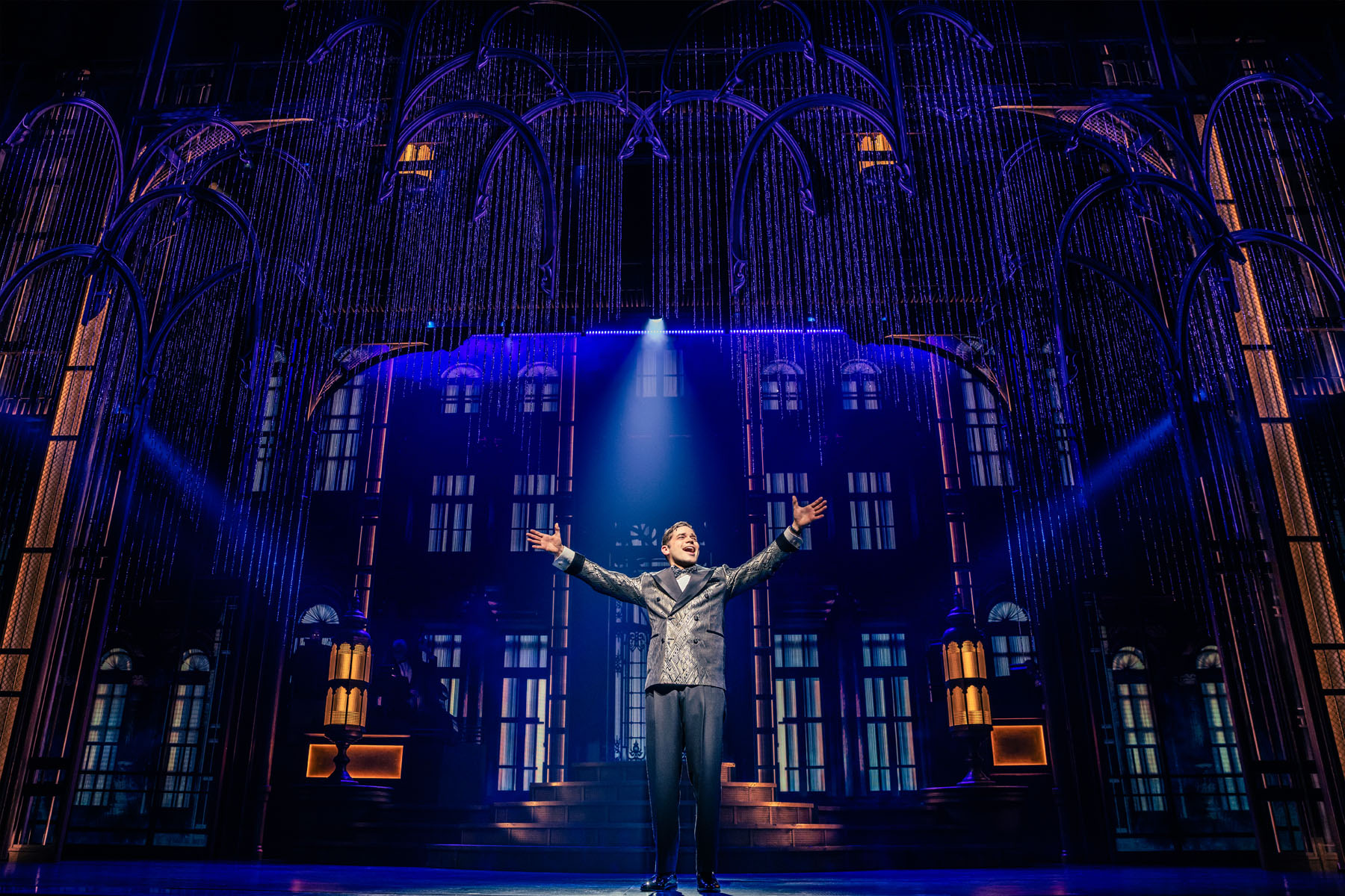 Man singing on stage in The Great Gatsby musical