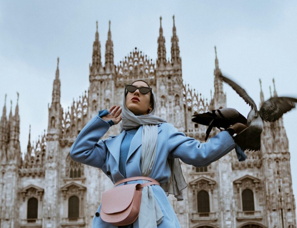 Woman wearing a blue coat outdoors