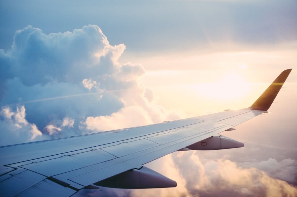 Airplane wing above clouds