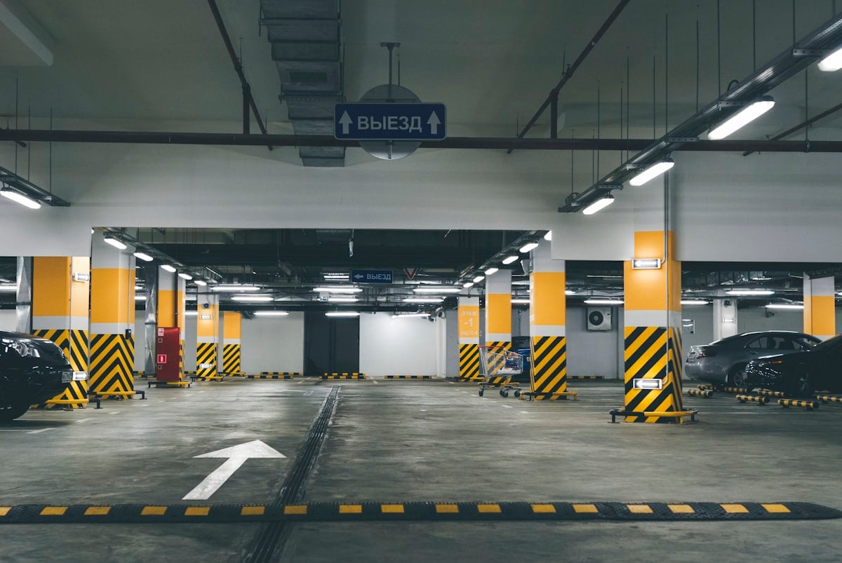 Parking sign beside a row of cars