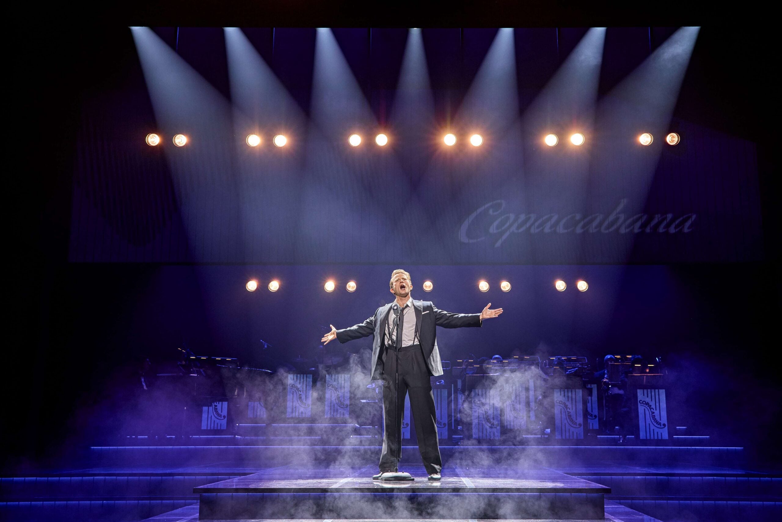 Sinatra The Musical solo singer under stage spotlights