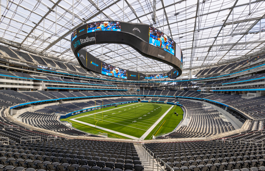 SoFi Stadium field framed by the open-air roof structure