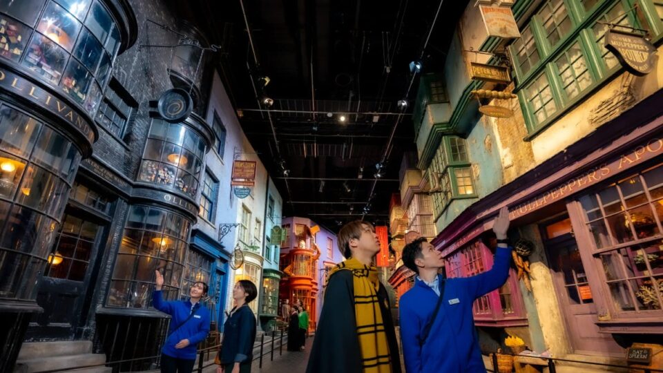 Visitors walking through the recreated Diagon Alley set at Warner Bros. Studios Japan