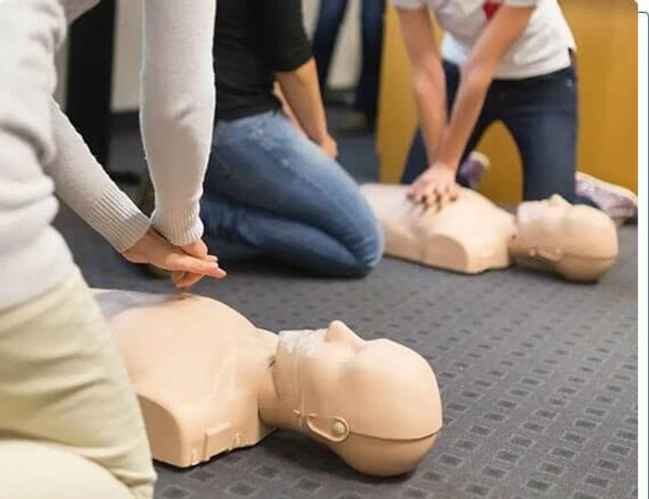 CPR learning scene with a student studying lifesaving skills