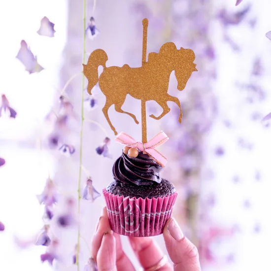 Carousel-topped cupcake from an afternoon tea catering selection