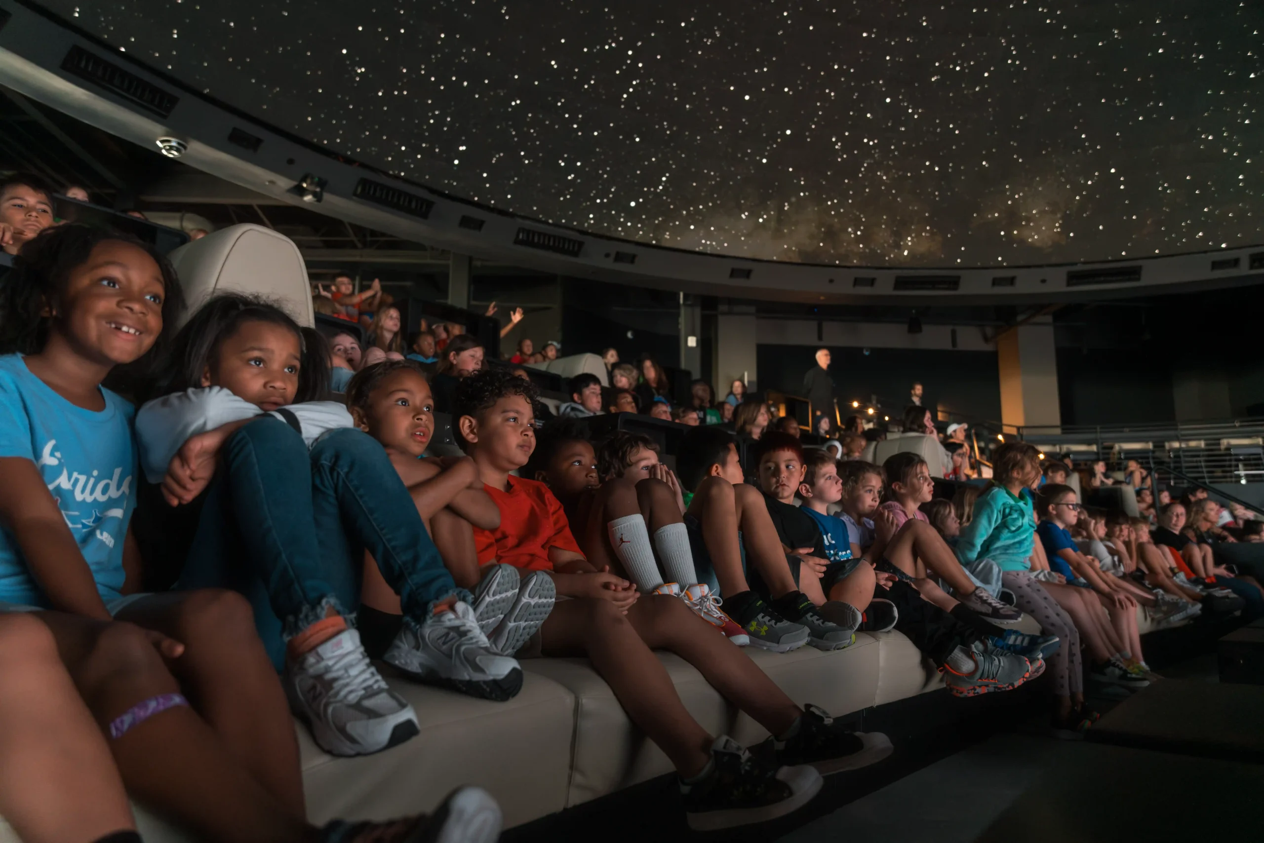 Students visiting Cosm Dallas for an immersive field trip