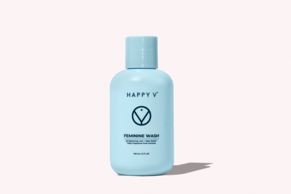 Happy V fragrance-free feminine wash bottle on a gray background