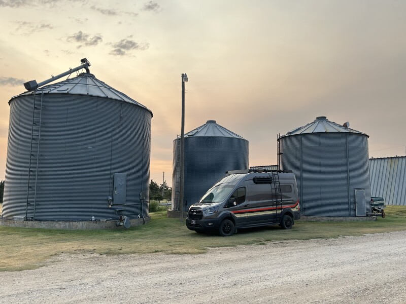 RV parked by grain silos at a rural Host location