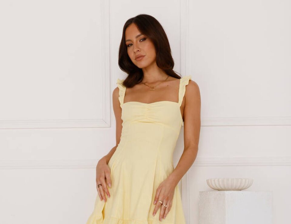 Yellow linen blend Ultimate Sundress mini dress on a model