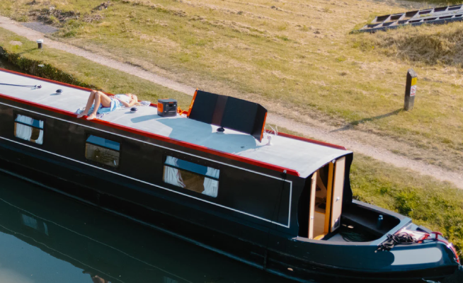 Narrowboat lifestyle scene with portable power equipment