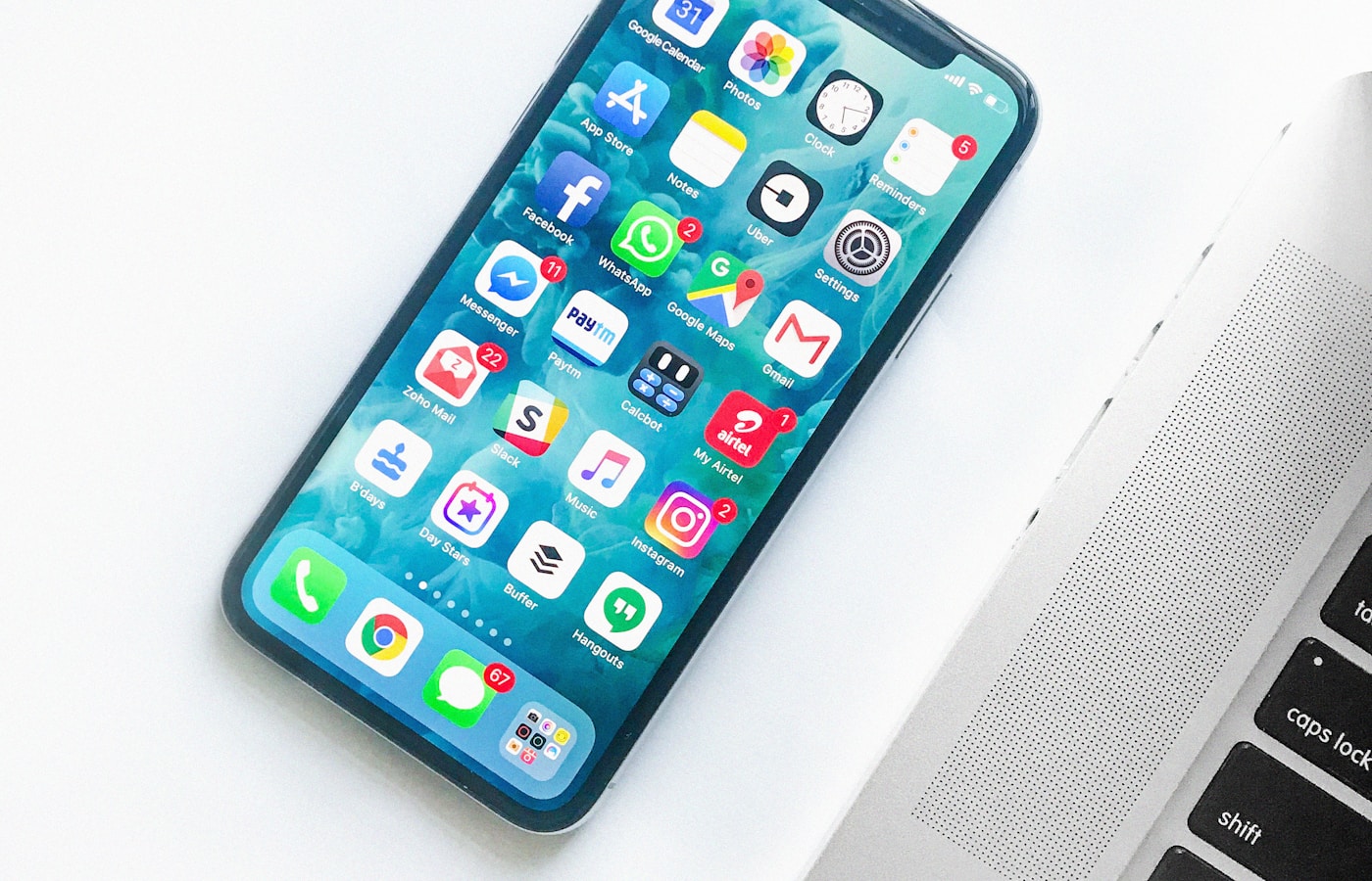 Smartphone resting on a desk beside everyday essentials