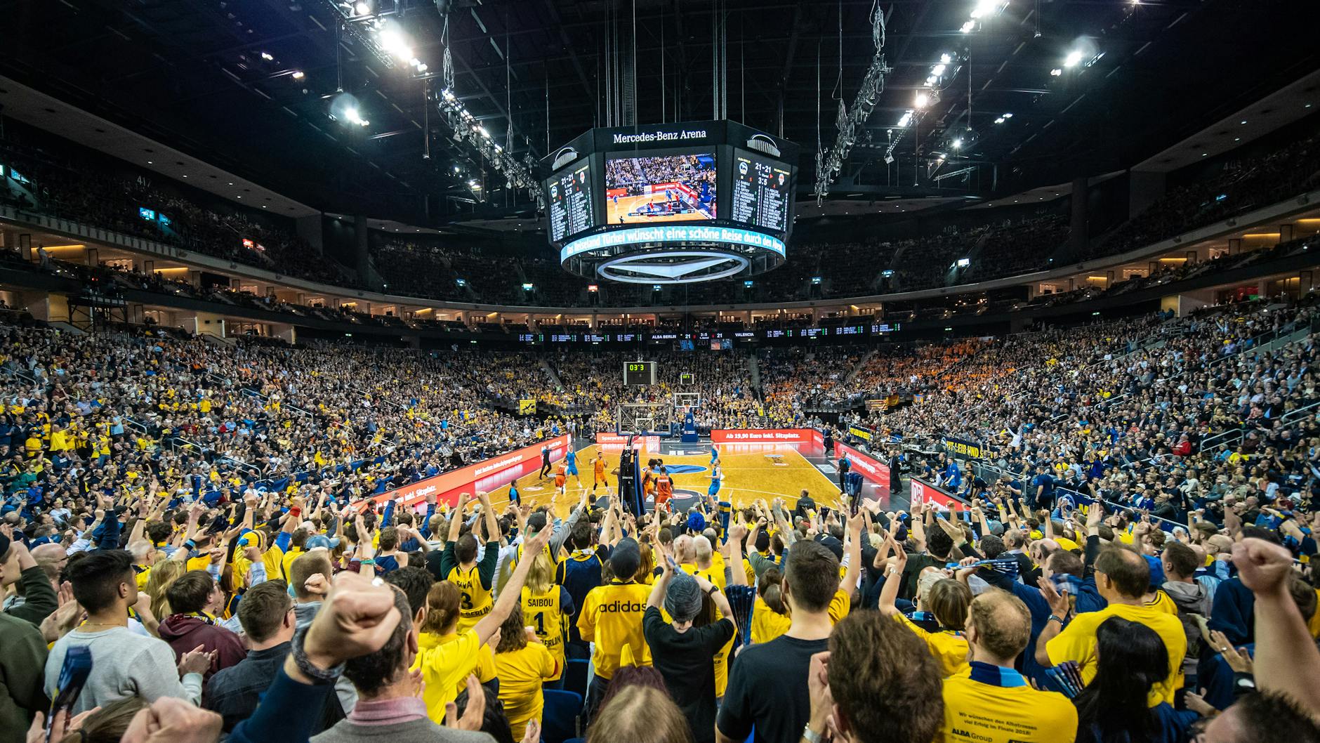 Wide view of an indoor basketball arena