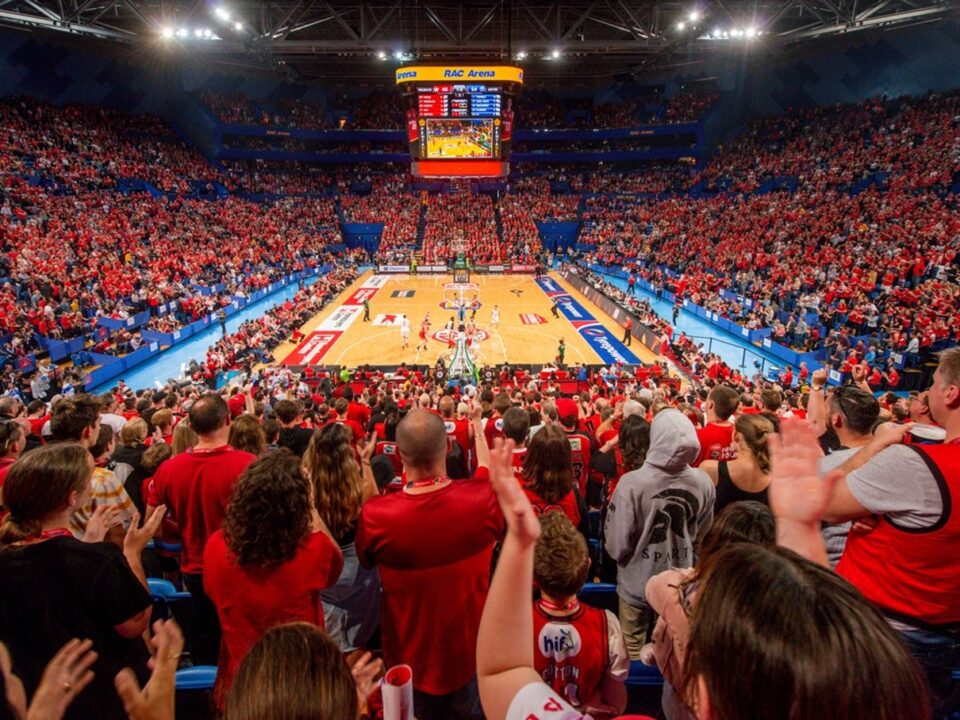 Indoor basketball game in a packed arena