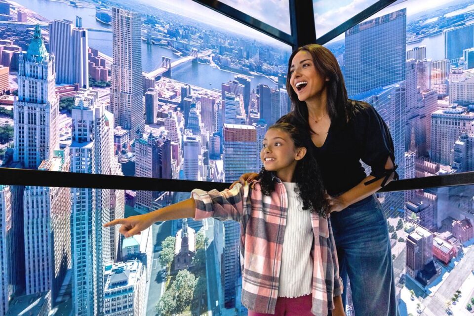 Visitors inside the immersive SkyPod elevator at One World Observatory