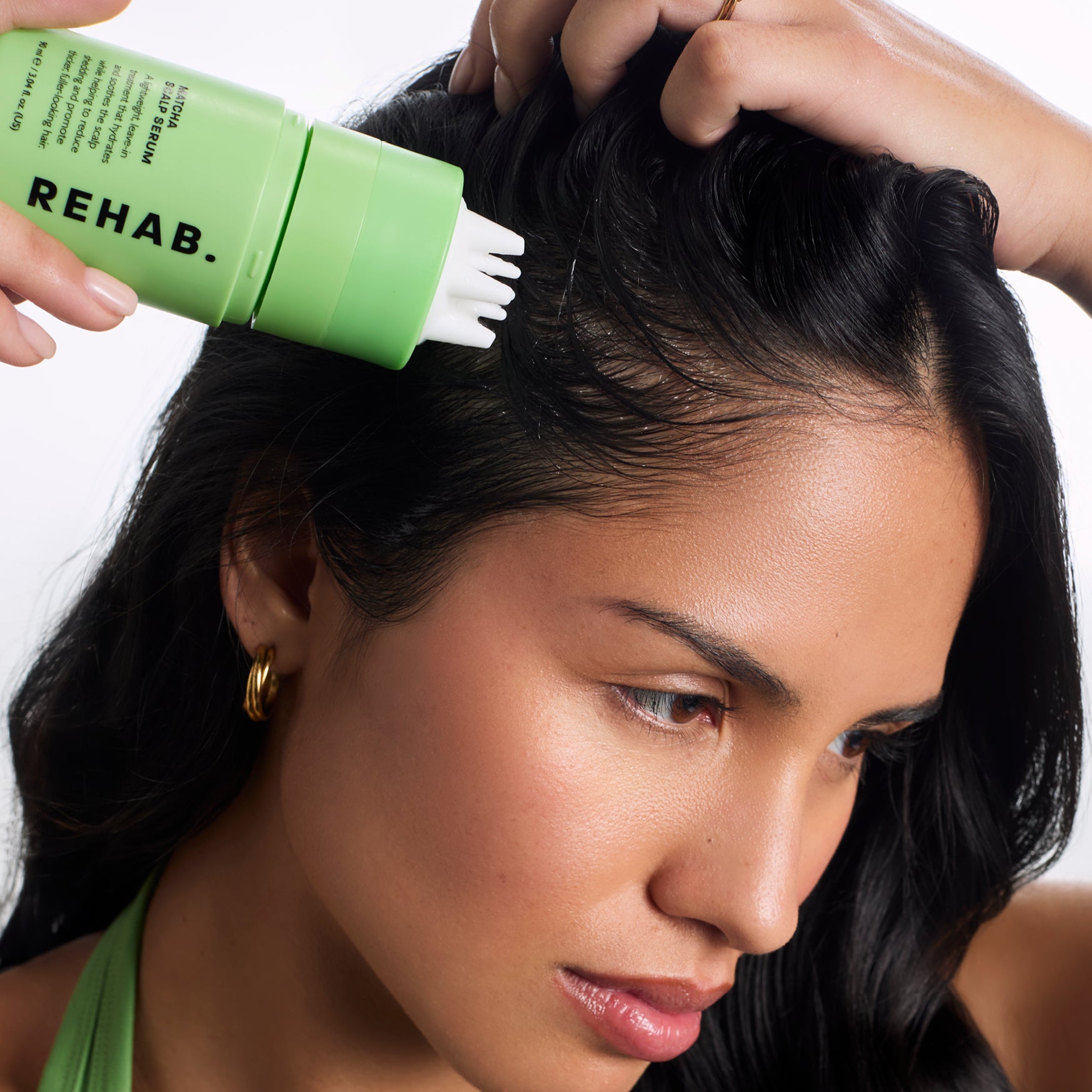 Model using REHAB Your Hair Matcha scalp care