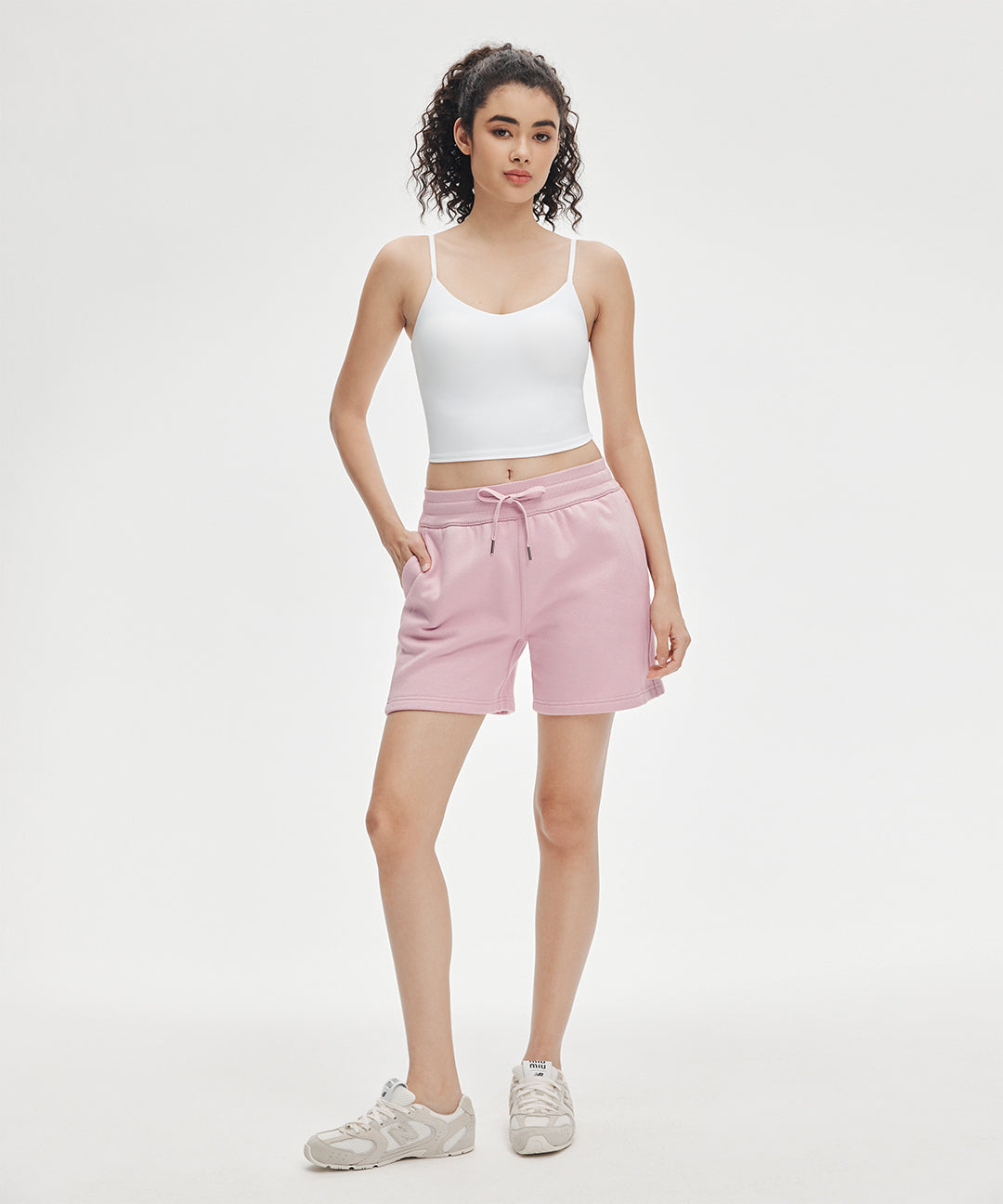 Athluna model wearing Cozy Up mid waist shorts