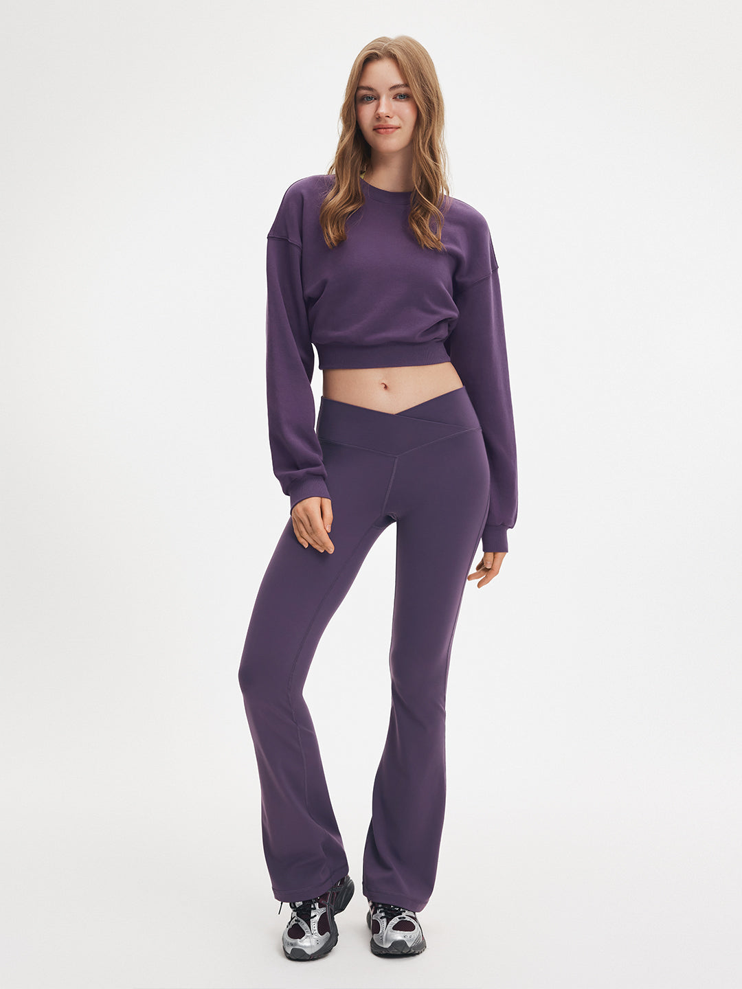 Athluna model wearing a crewneck cropped sweatshirt