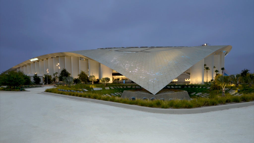 SoFi Stadium illuminated at dusk