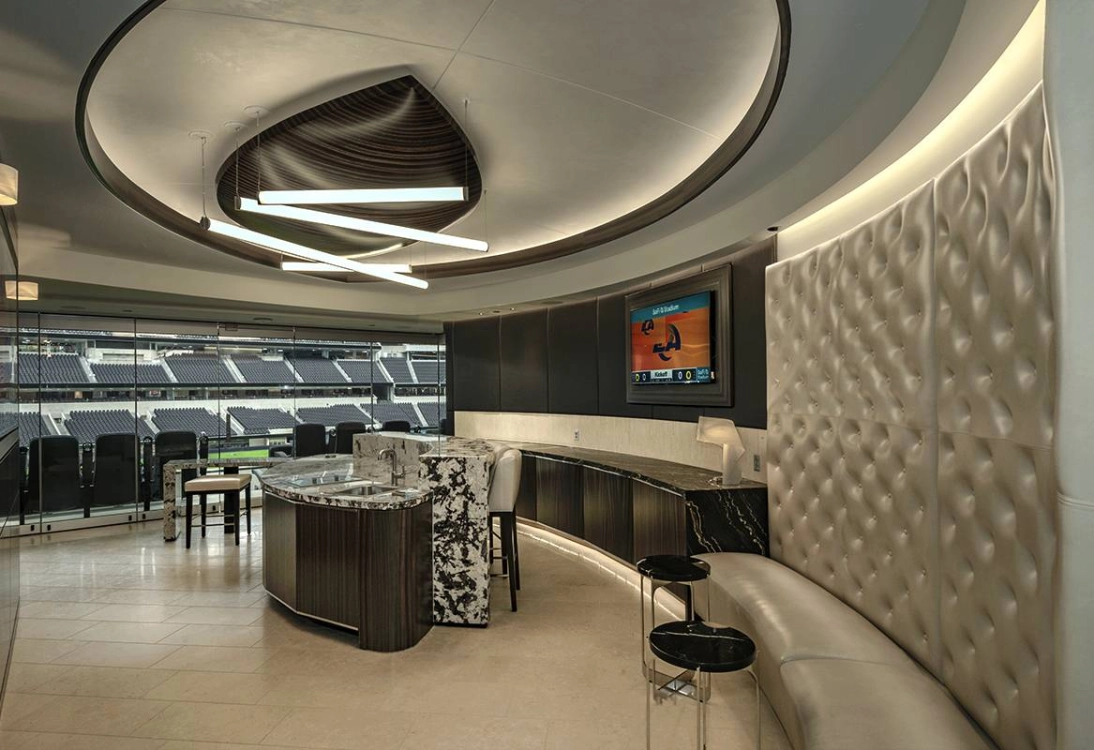 SoFi Stadium executive suite with marble bar and panoramic seating view