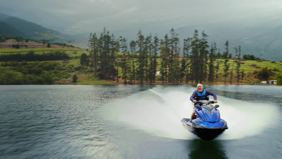 Person enjoying a jet ski on holiday