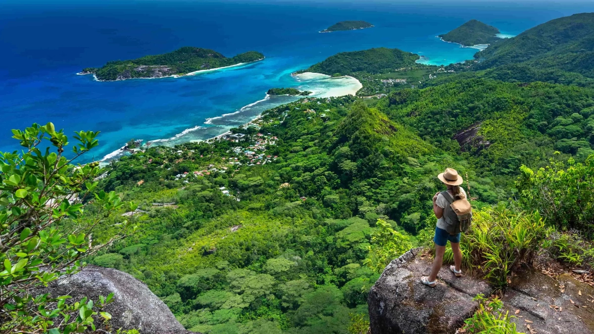 Woman looking across a tropical island