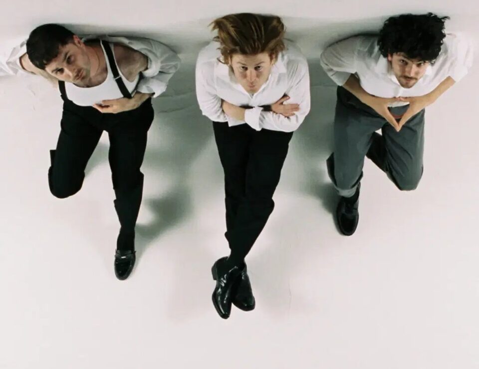 Three members of The Amazons viewed from overhead