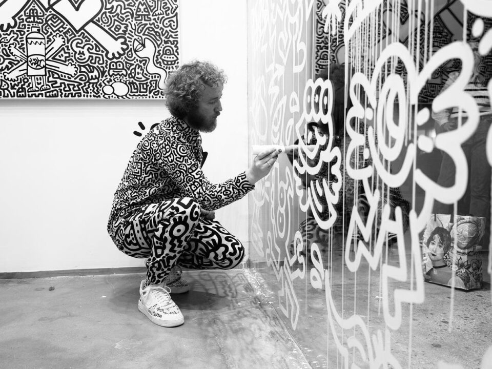 Artist painting a glass mural at The View from The Shard