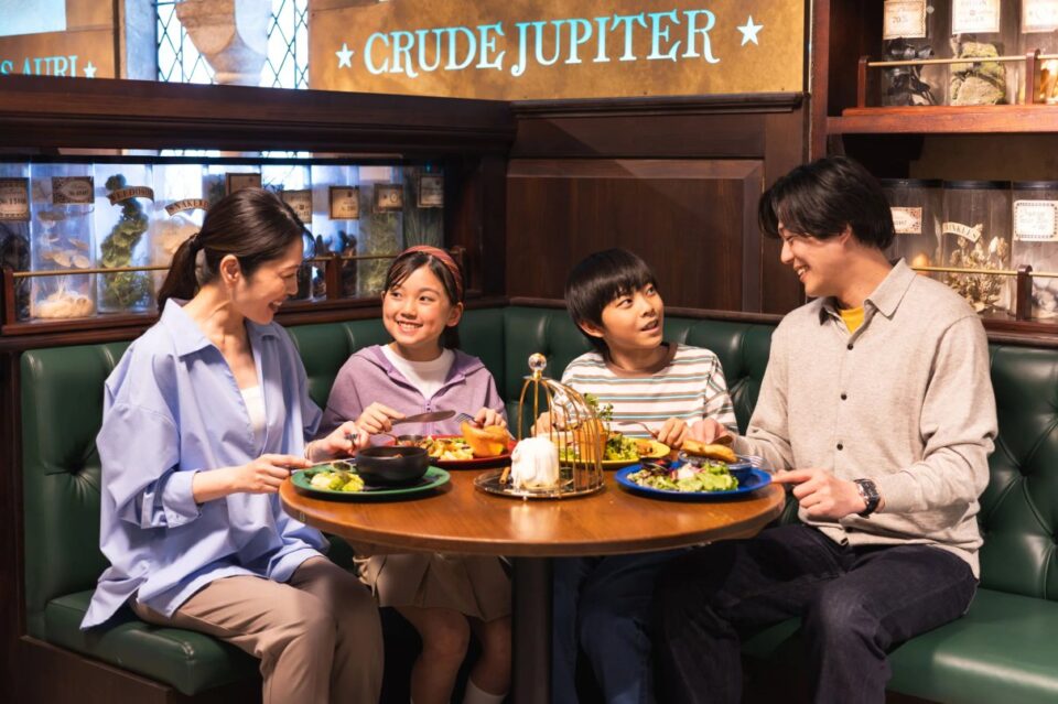 Family enjoying food during a visit to Warner Bros. Studios Japan