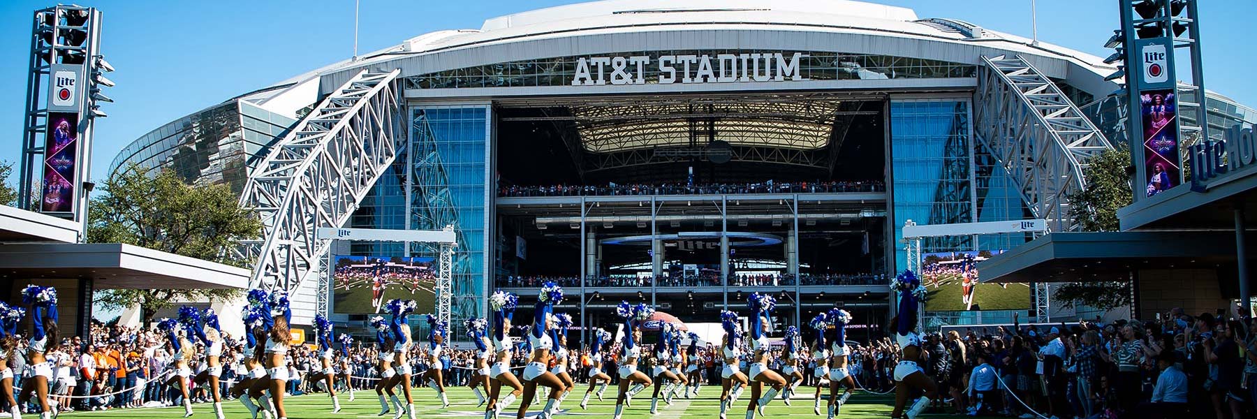 Dallas Cowboys Cheerleaders outside a stadium entrance