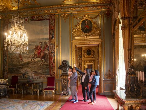 Visitors inside Blenheim Palace's historic interior