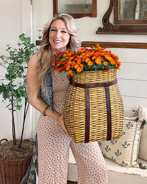 Oversized handwoven rattan wall basket with a leather handle