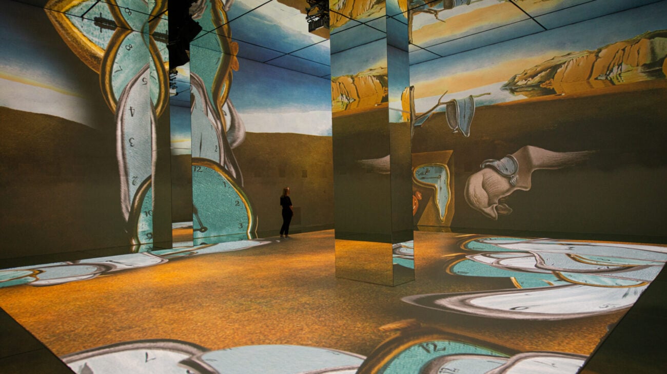 Surrealist artwork projected across a gallery wall