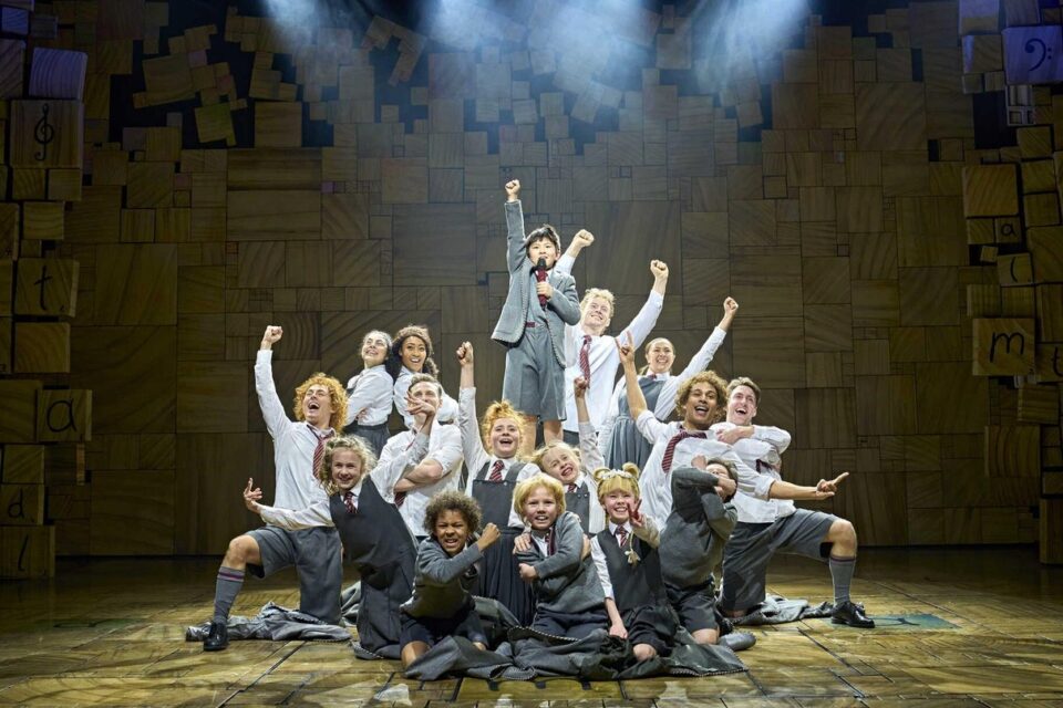 Young performer as Matilda on the musical stage