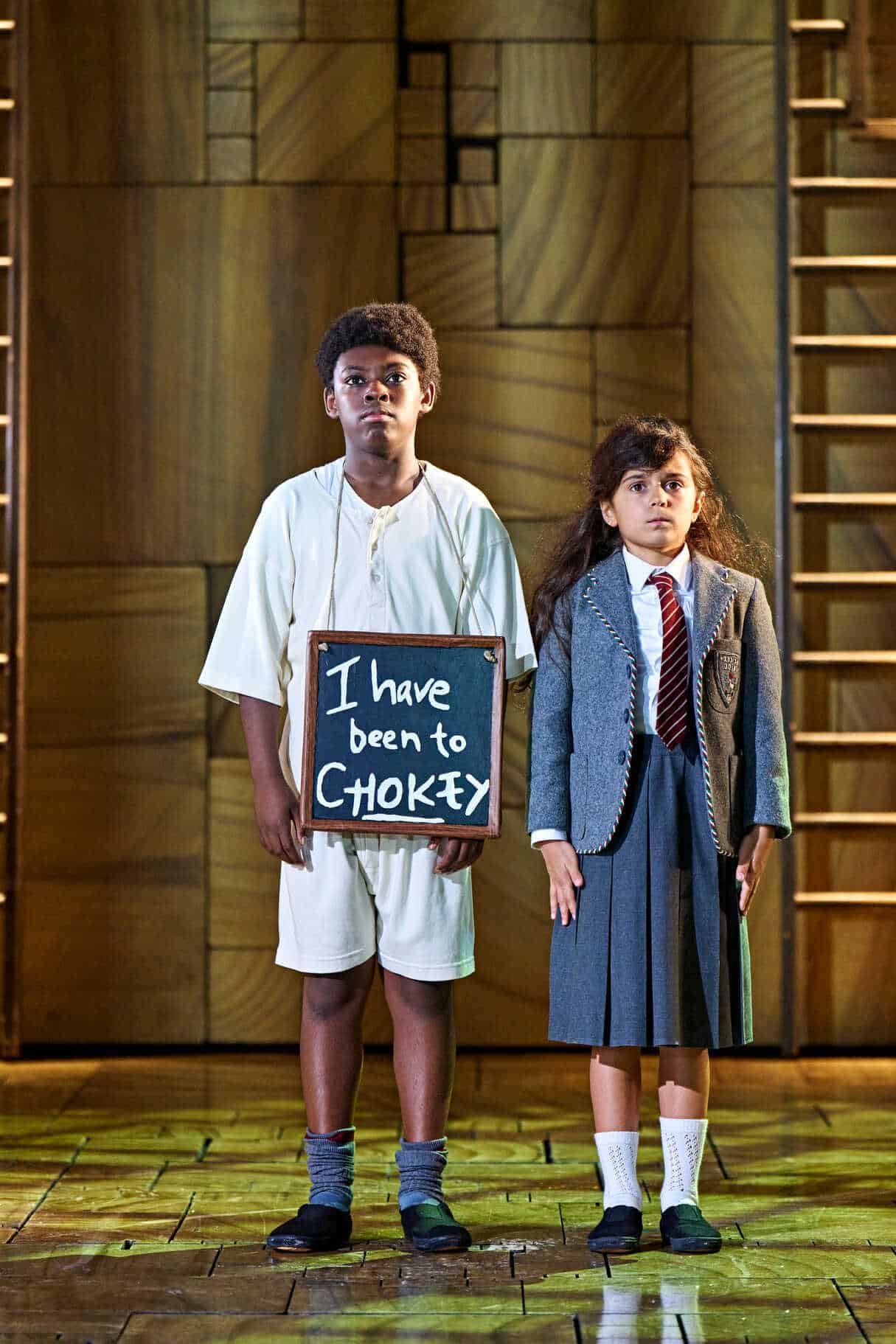 Performers on stage in another Matilda The Musical production scene