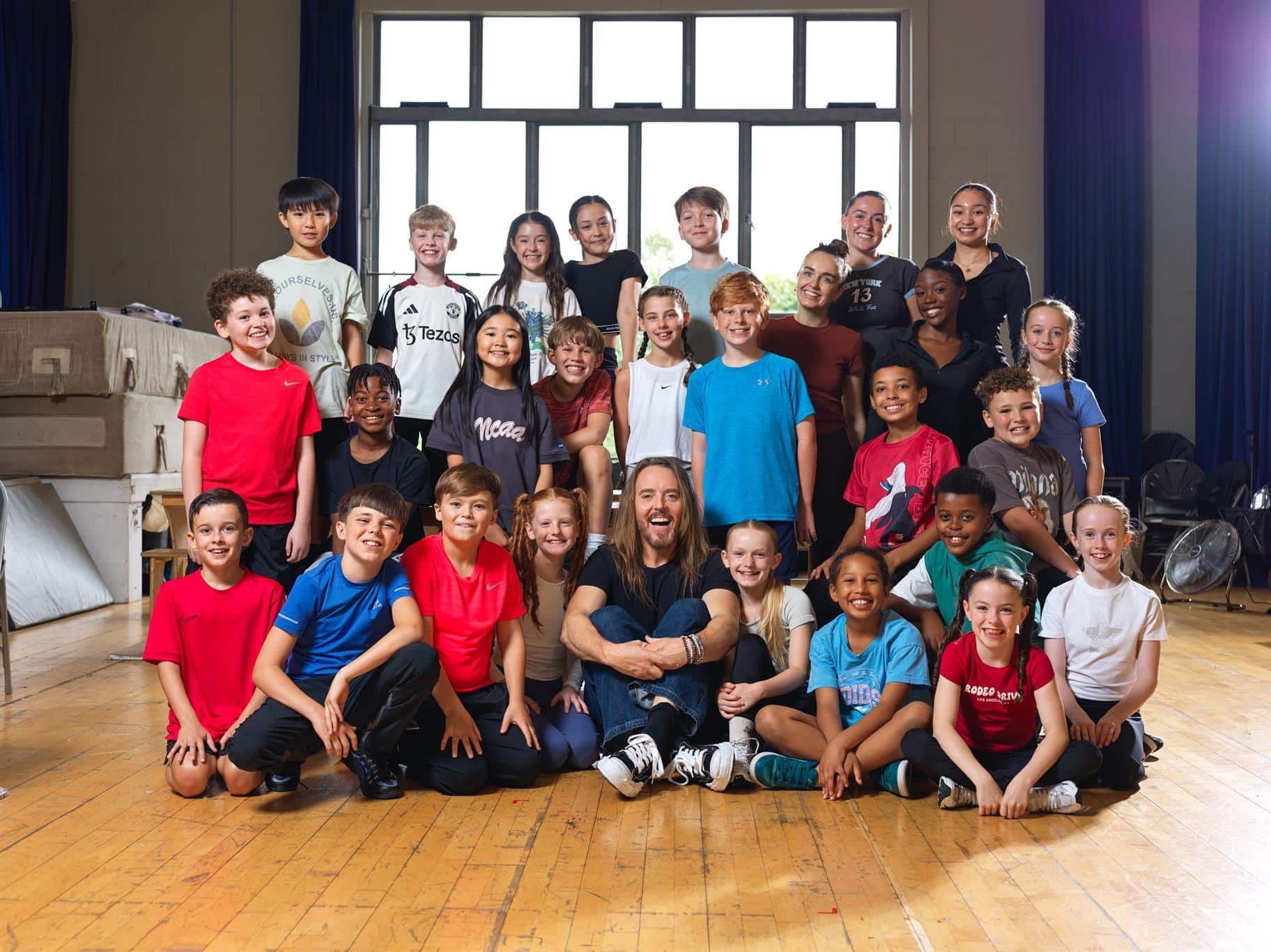 Tim Minchin with the young touring cast of Matilda