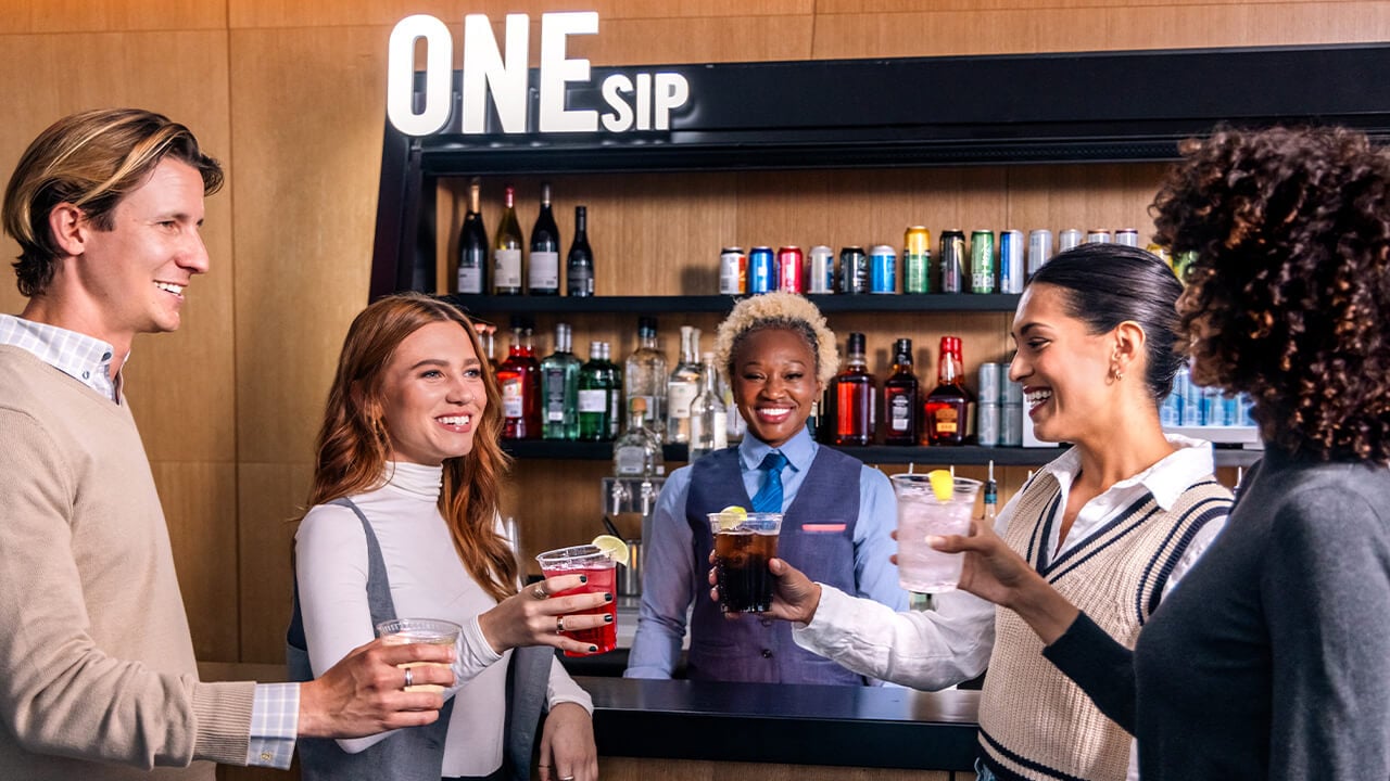 Guests enjoying drinks with a skyline setting at One World Observatory