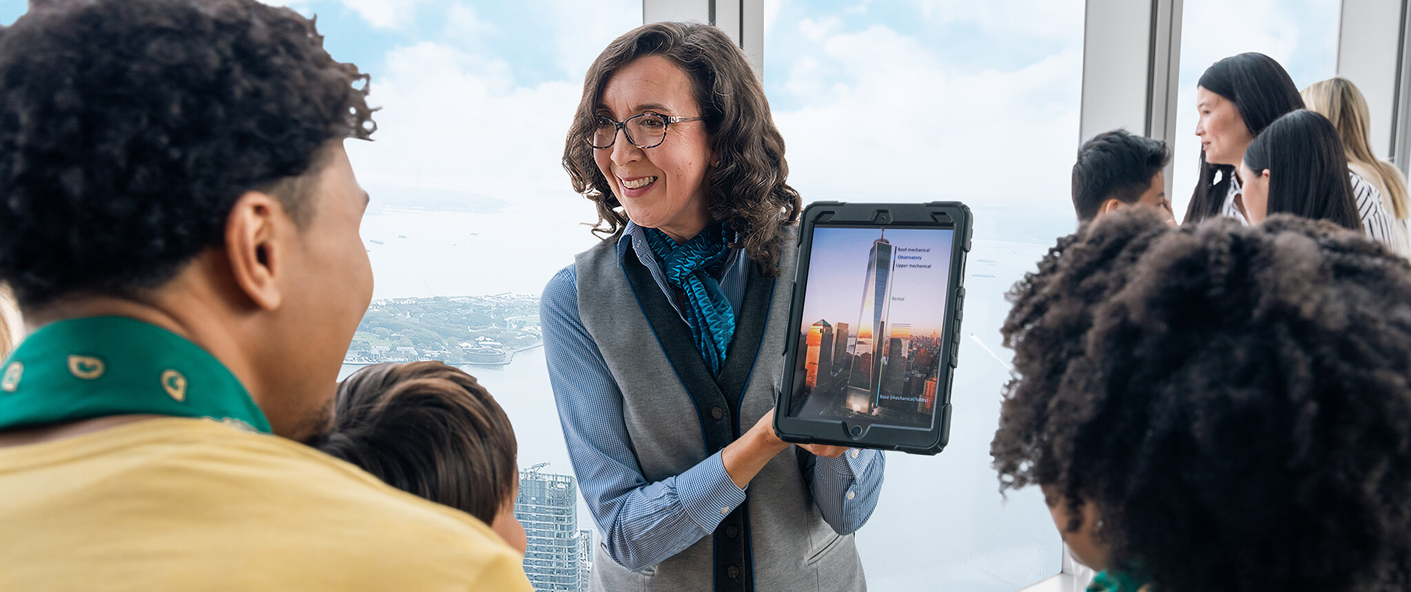 Guide speaking with visitors at One World Observatory
