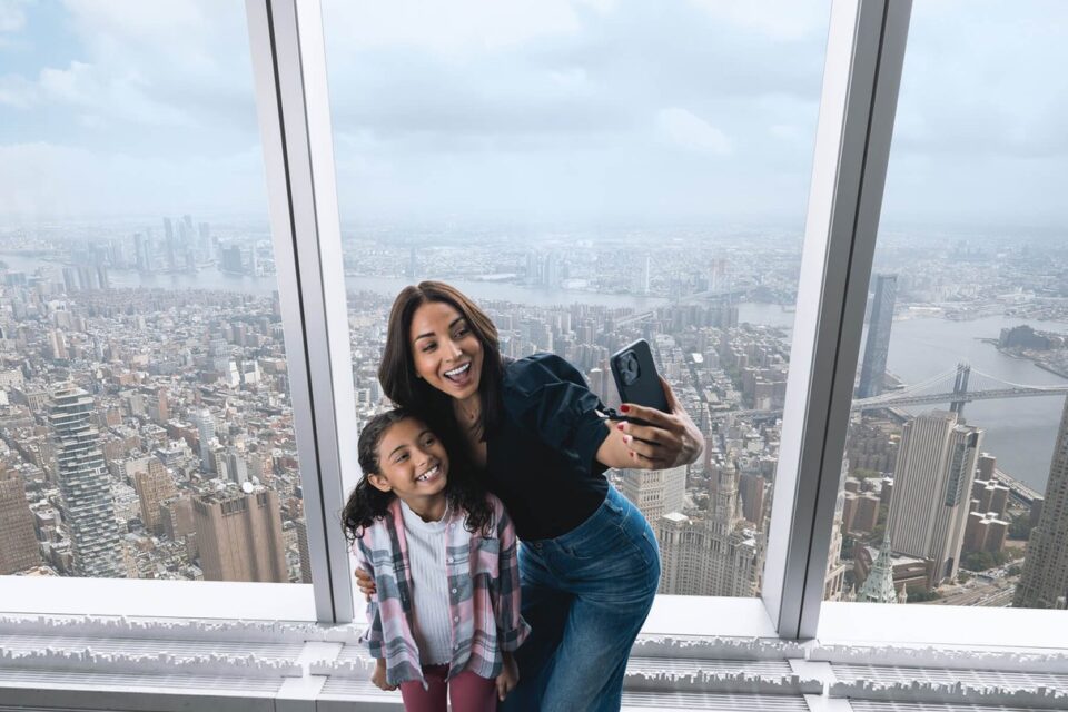 Family viewing the New York skyline from the observation level