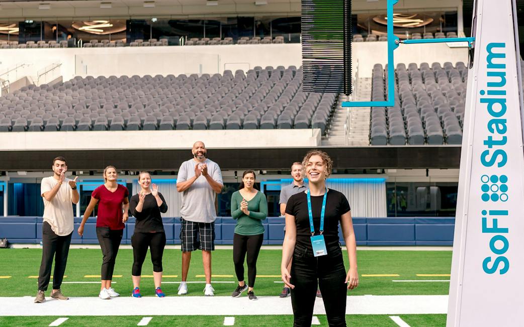Visitors on an upper-level SoFi Stadium guided tour