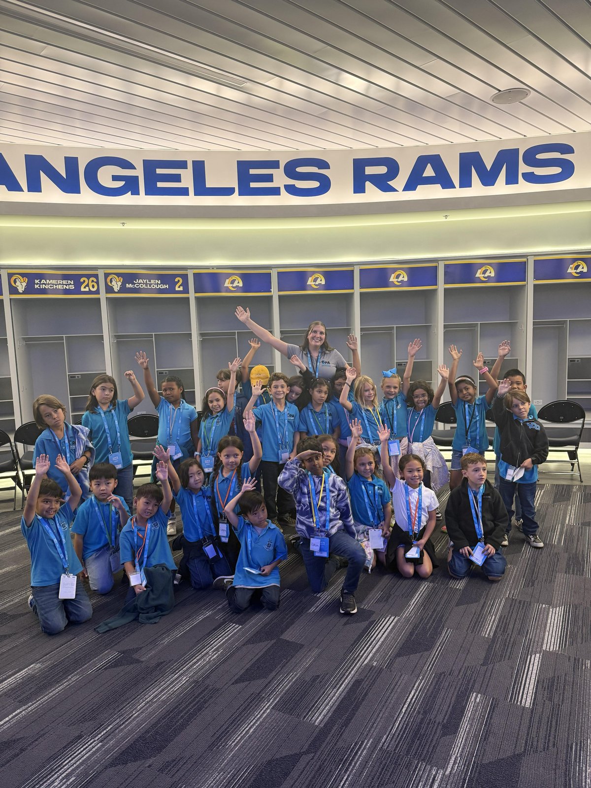 Students visiting the Rams locker room at SoFi Stadium