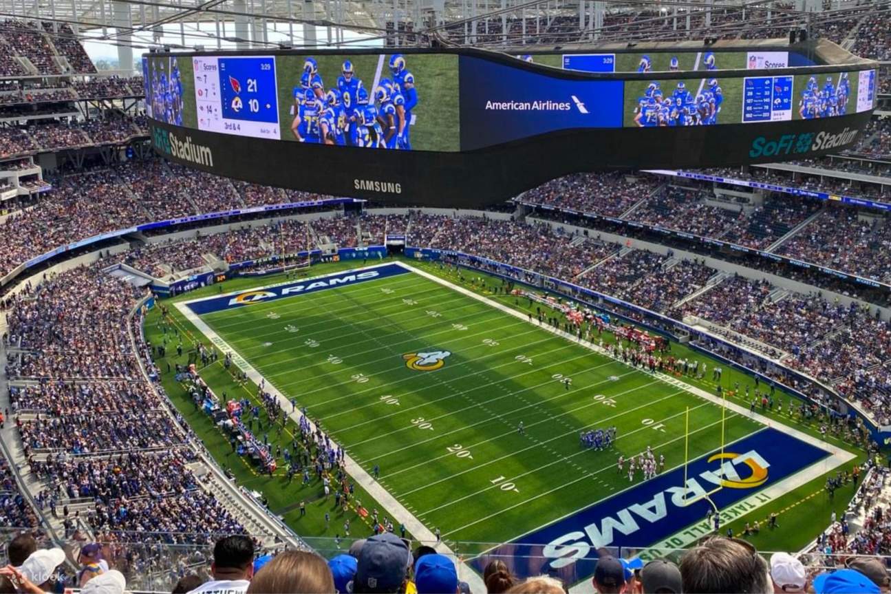 Fans watching a football game inside SoFi Stadium