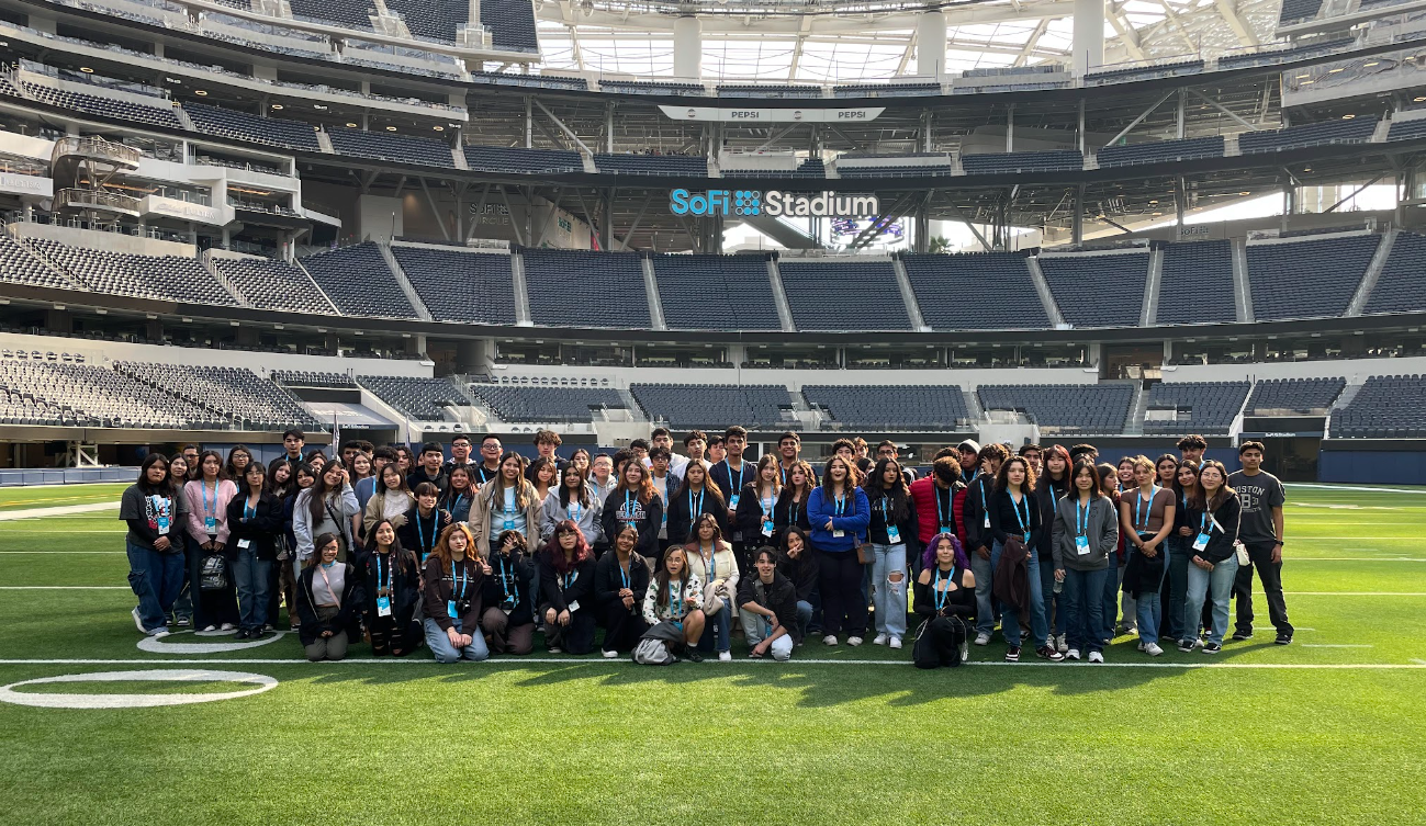 Students gathered on the SoFi Stadium field during a tour